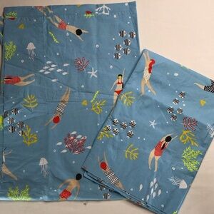 Pair of The Company Store Cotton Pillowcases Blue with Colorful Swimmers